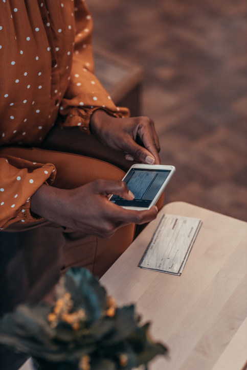 woman scanning check